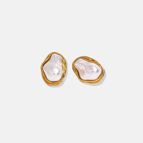 Pair of pearl earrings with gold frames on a white background
