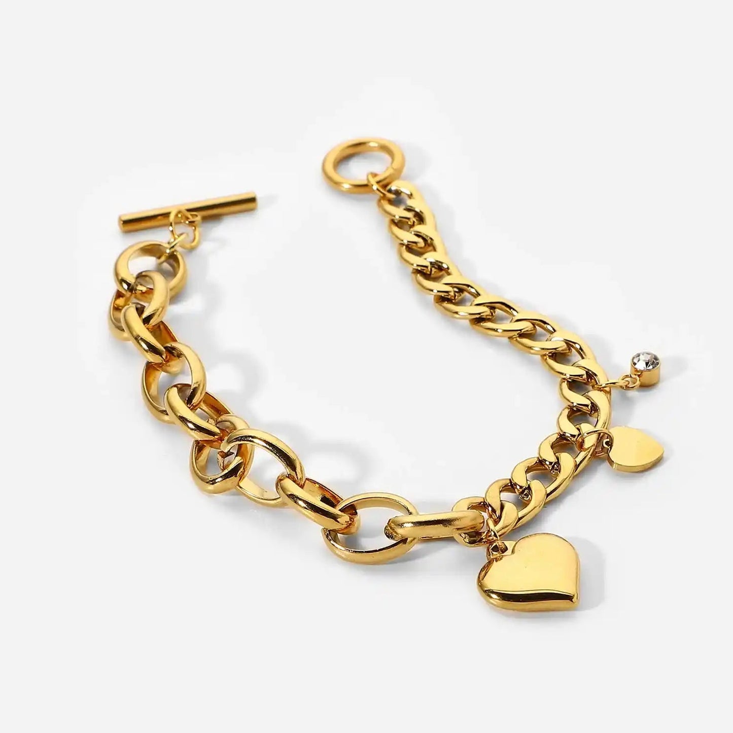 Gold chain bracelet with heart-shaped charms on a white background