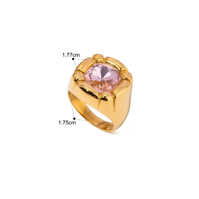Gold ring with a pink gemstone on a white background