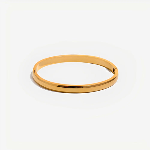 Gold bangle on a white background