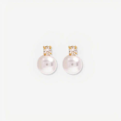 Pearl earrings with gold and crystal accents on a white background