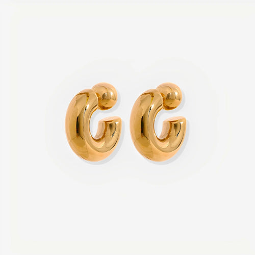Gold hoop earrings on a white background
