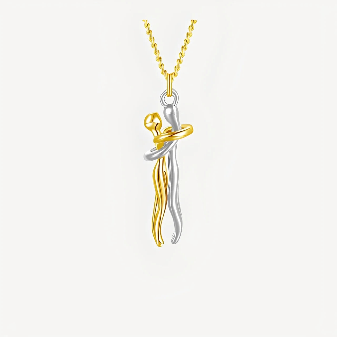 Two-tone gold and silver pendant on a white background