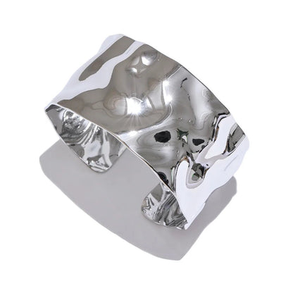 Silver ring with a unique design on a white background