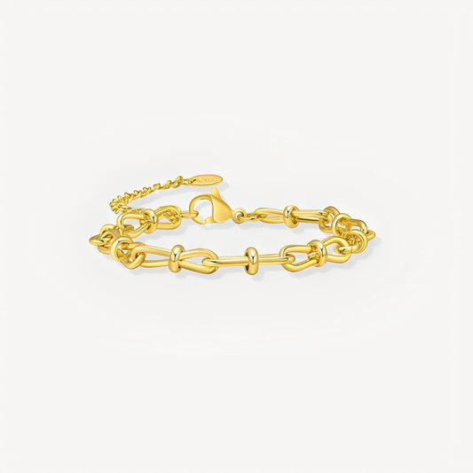 Gold chain bracelet on a white background