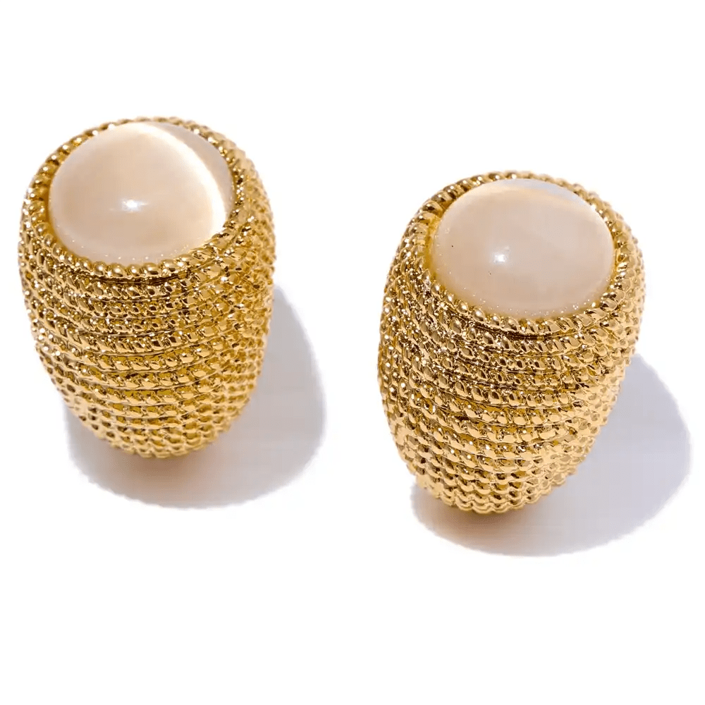 Gold mesh earrings with beige centers on a white background