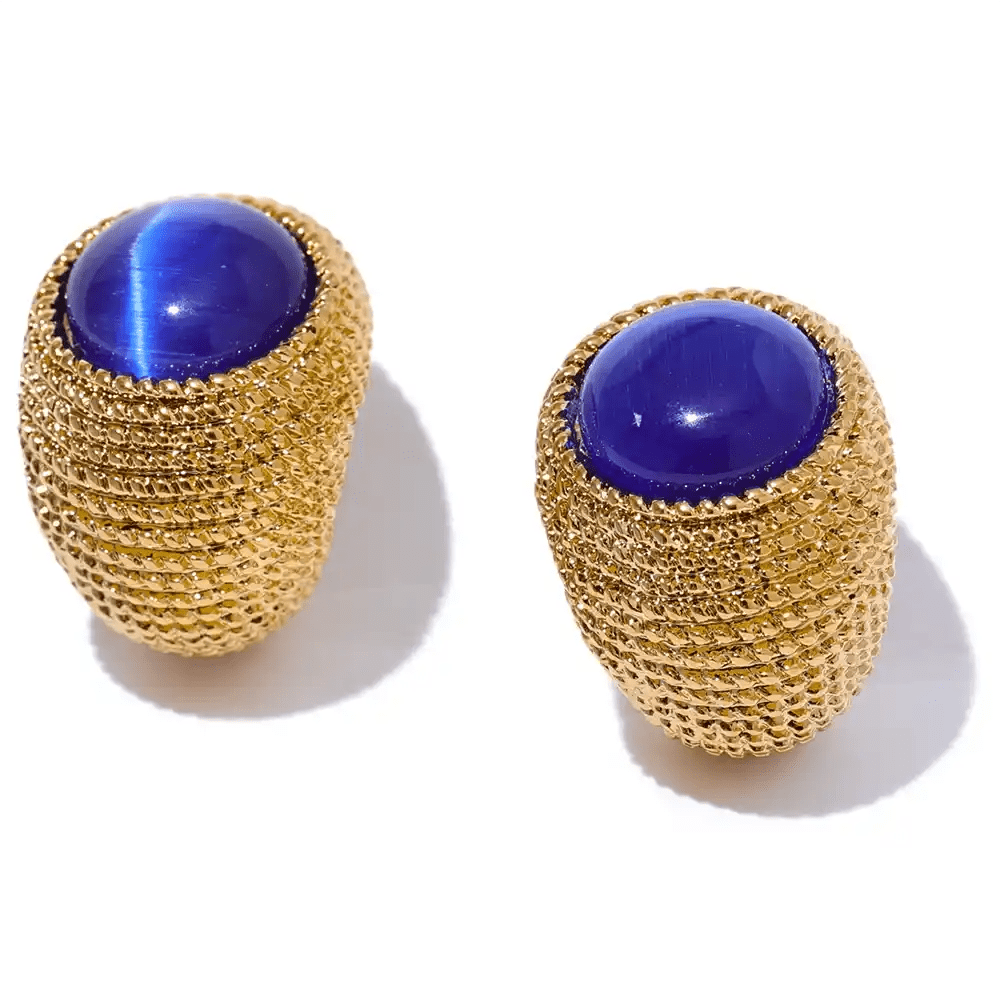 Gold mesh earrings with blue gemstones on a white background