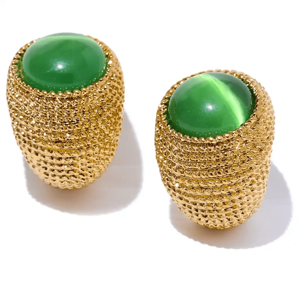 Gold mesh earrings with green stones on a white background