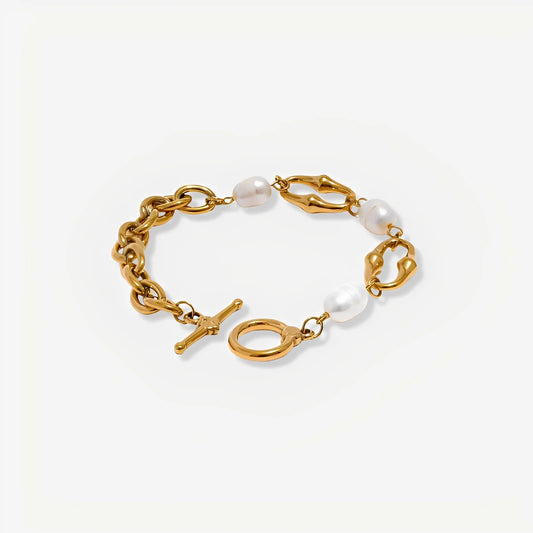 Gold bracelet with pearls on a white background