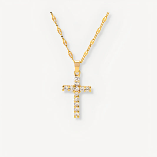 Gold cross necklace with diamonds on a white background