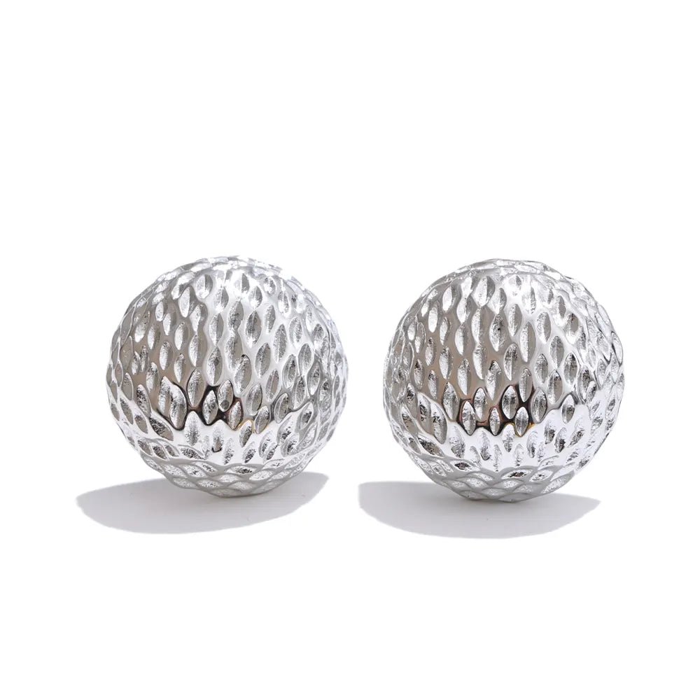 Two silver textured spherical objects on a white background
