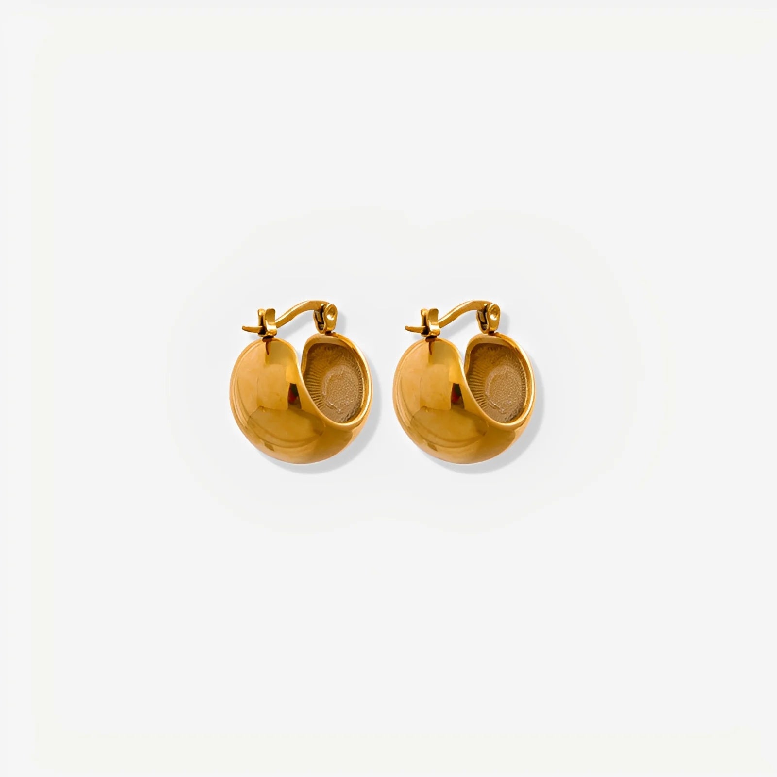 Gold hoop earrings on a white background