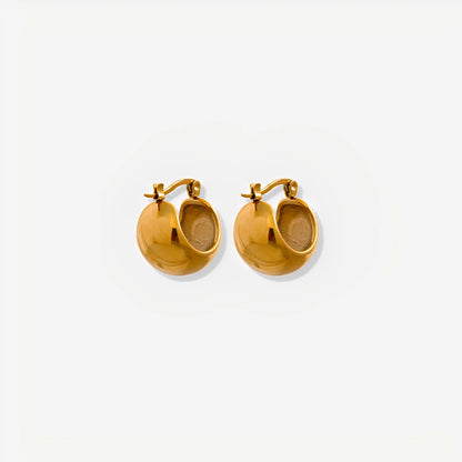 Gold hoop earrings on a white background