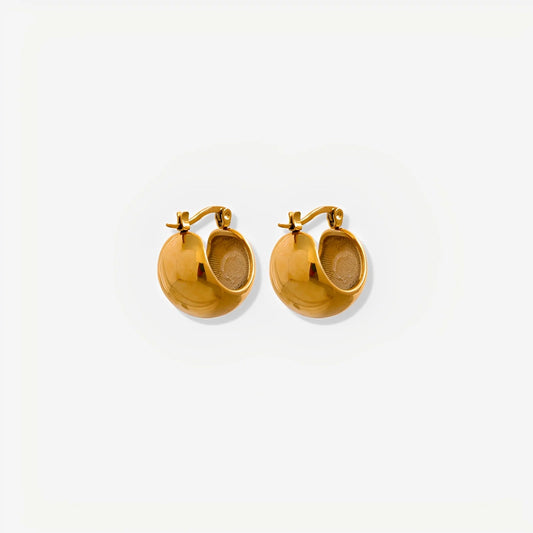 Gold hoop earrings on a white background