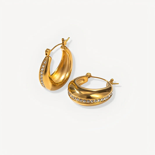 Gold hoop earrings with embedded stones on a white background
