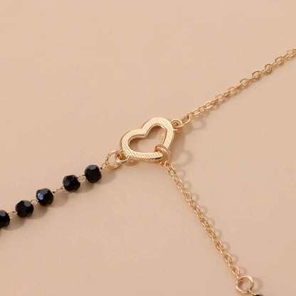 Dainty Heart Black and Gold Lariat Necklace