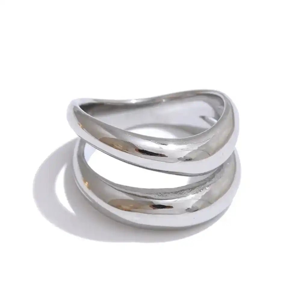 Silver ring with a modern design on a white background