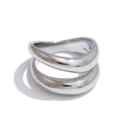 Silver ring with a modern design on a white background