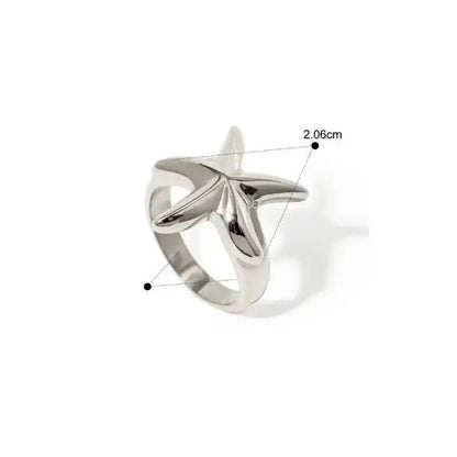 Silver ring with starfish design on a white background