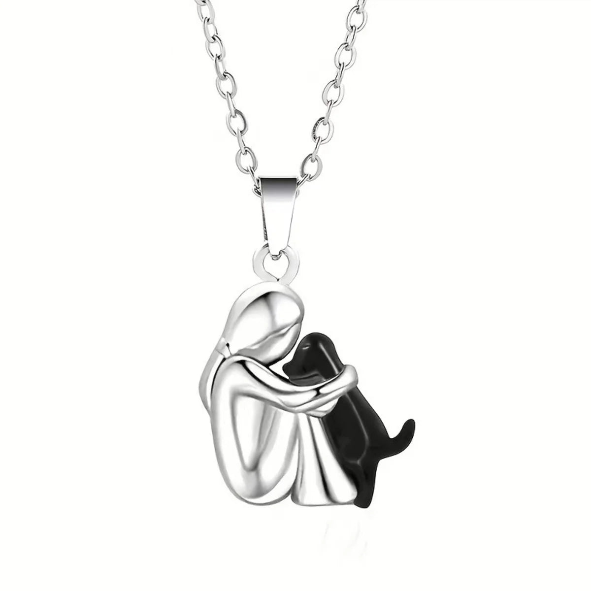 Silver necklace with a pendant of a person hugging a cat on a white background