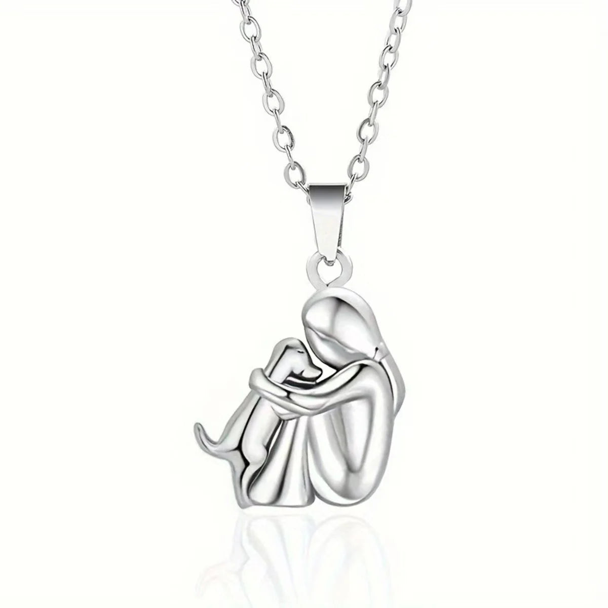 Silver necklace with a pendant of a mother and child on a white background