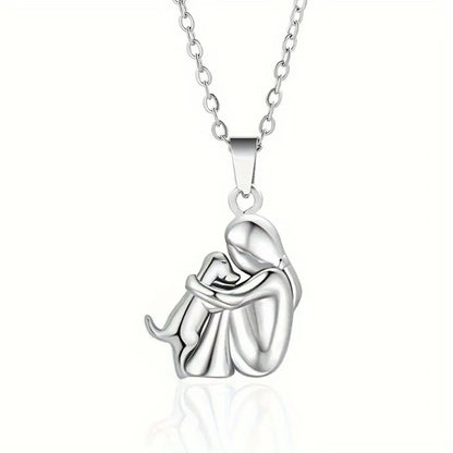 Silver necklace with a pendant of a mother and child on a white background