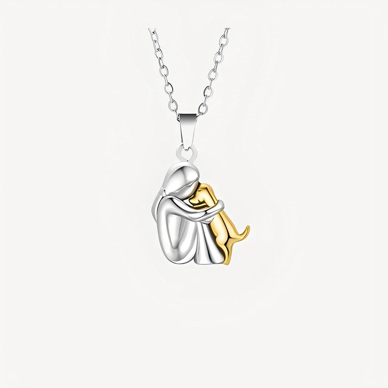 Necklace with a silver and gold pendant on a white background