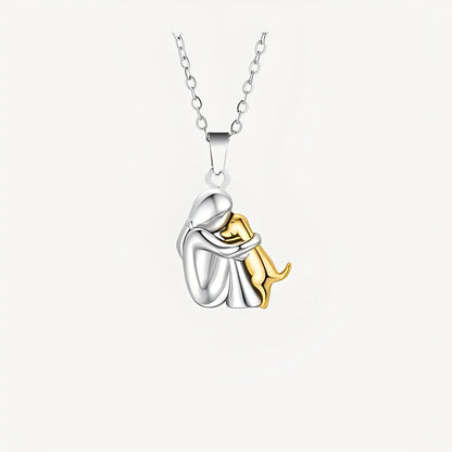 Necklace with a silver and gold pendant on a white background