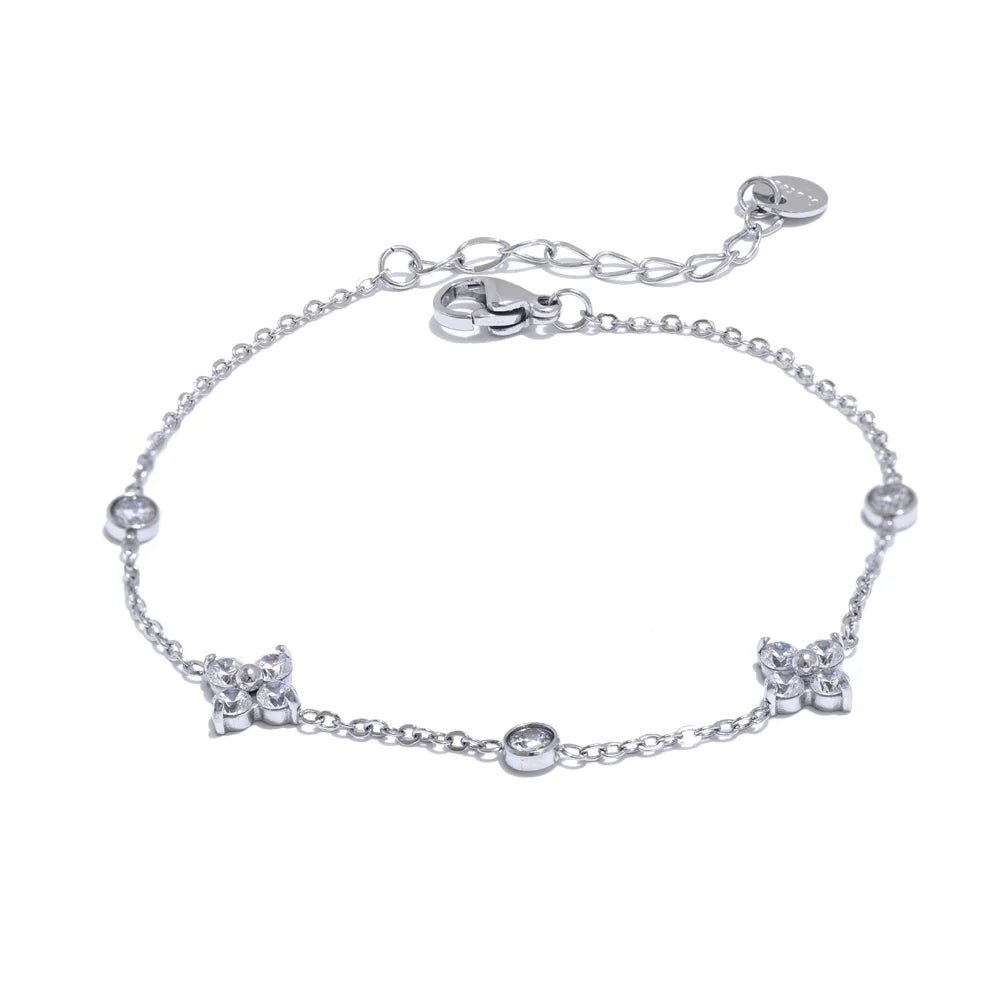 Silver bracelet with star-shaped charms on a white background