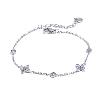 Silver bracelet with star-shaped charms on a white background