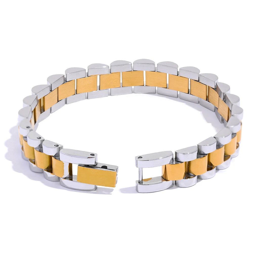 Two-tone silver and gold bracelet on a white background