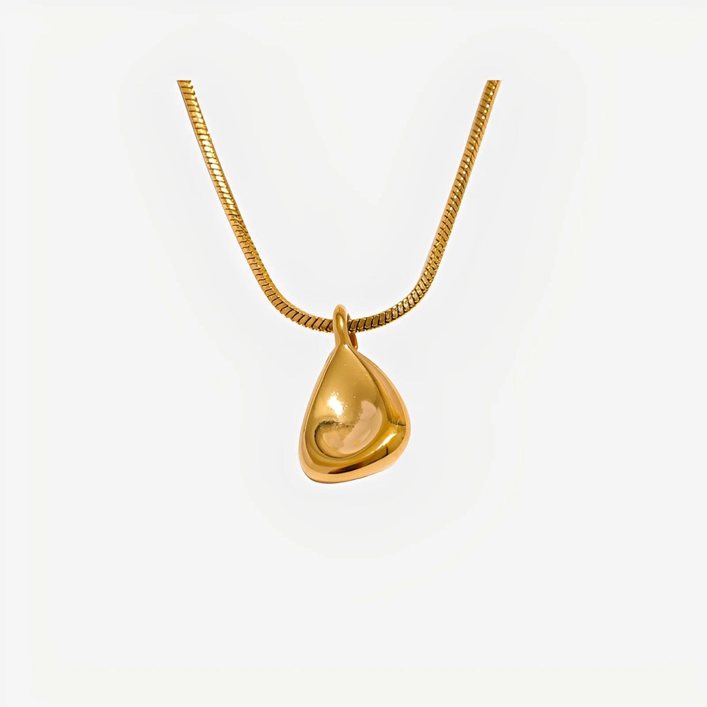 Gold teardrop pendant necklace on a white background