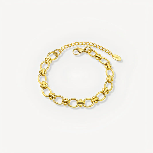 Gold chain bracelet on a white background