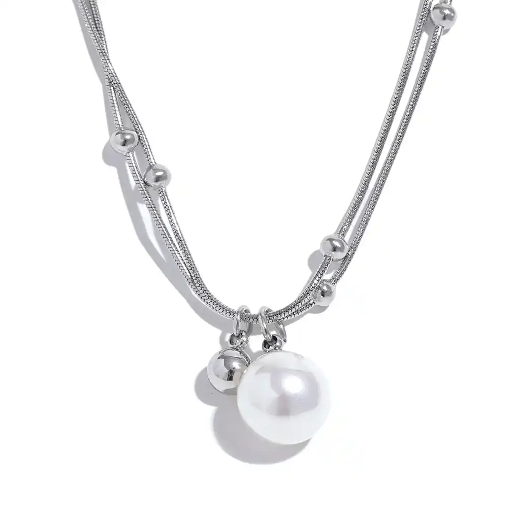 Silver necklace with pearls on a white background