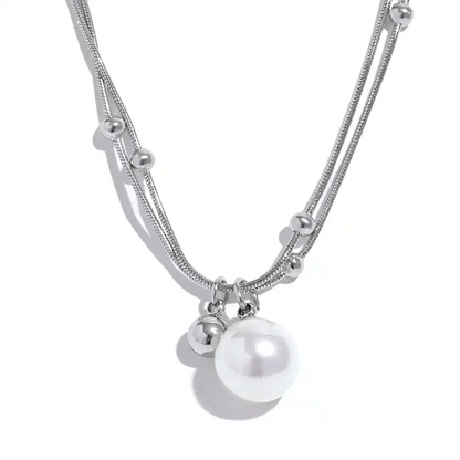 Silver necklace with pearls on a white background