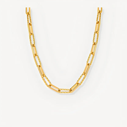 Gold chain necklace on a white background