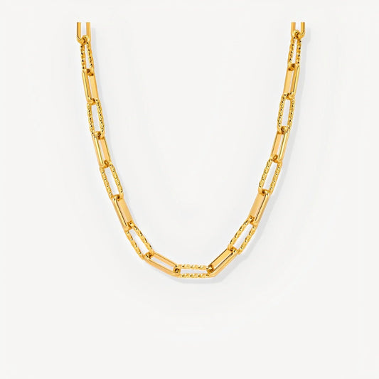 Gold chain necklace on a white background