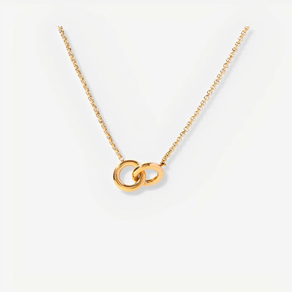 Gold necklace with interlocking rings on a white background