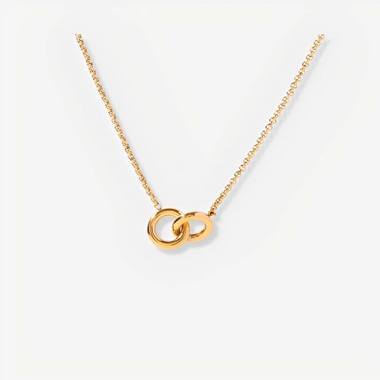 Gold necklace with interlocking rings on a white background