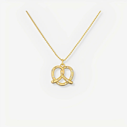 Gold necklace with a double interlocking ring pendant on a white background