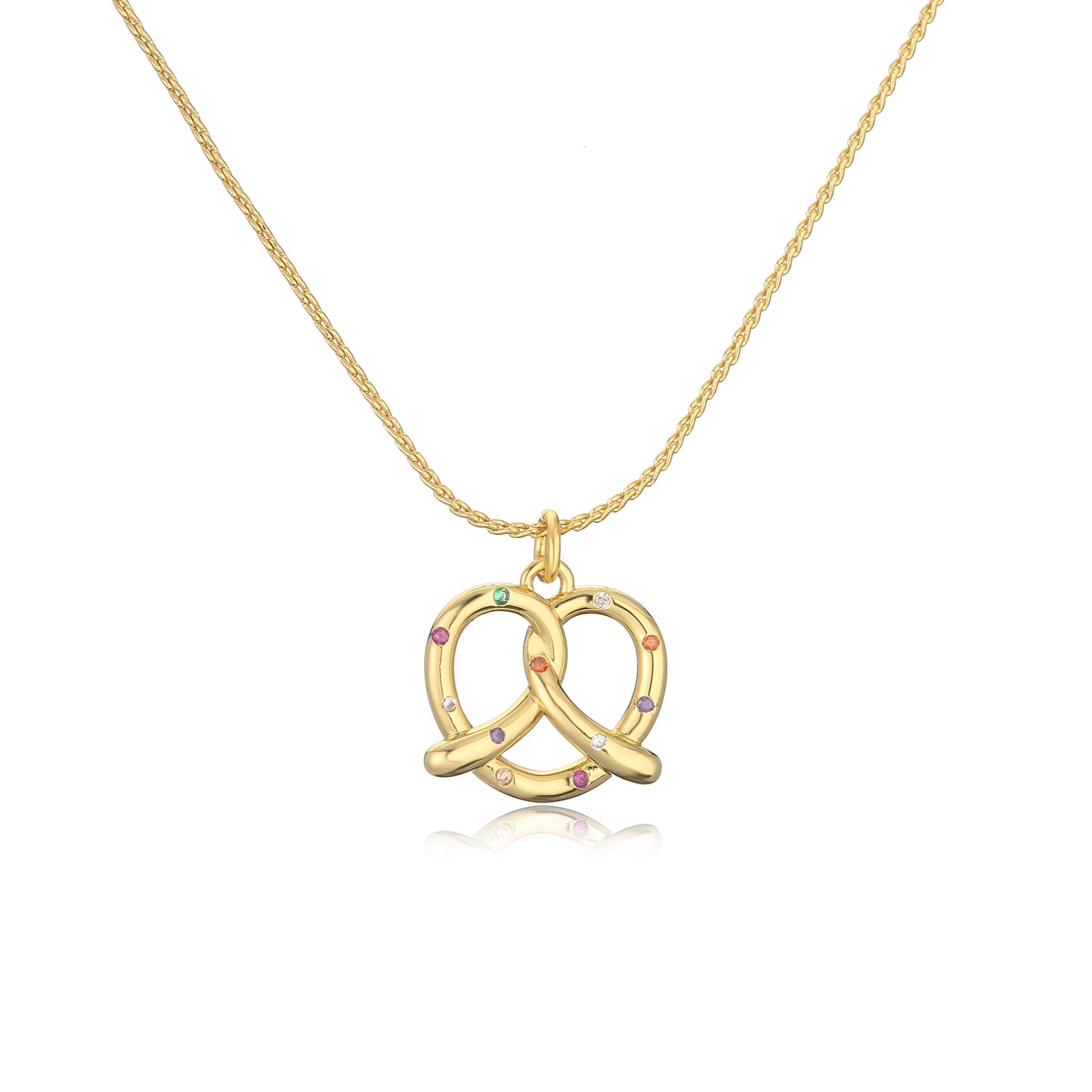 Gold pretzel-shaped pendant necklace with colorful stones on a white background