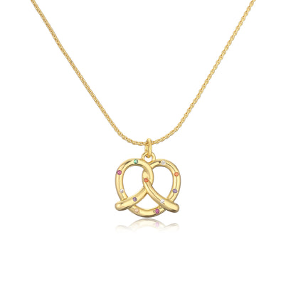 Gold pretzel-shaped pendant necklace with colorful stones on a white background