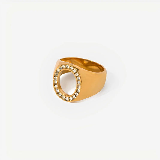Gold ring with gemstones on a white background