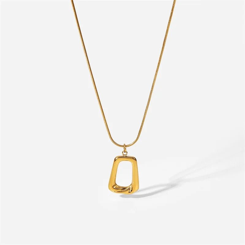 Gold necklace with a unique pendant on a white background