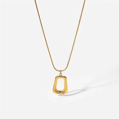 Gold necklace with a unique pendant on a white background
