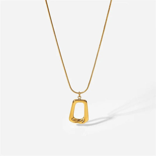 Gold necklace with a unique pendant on a white background