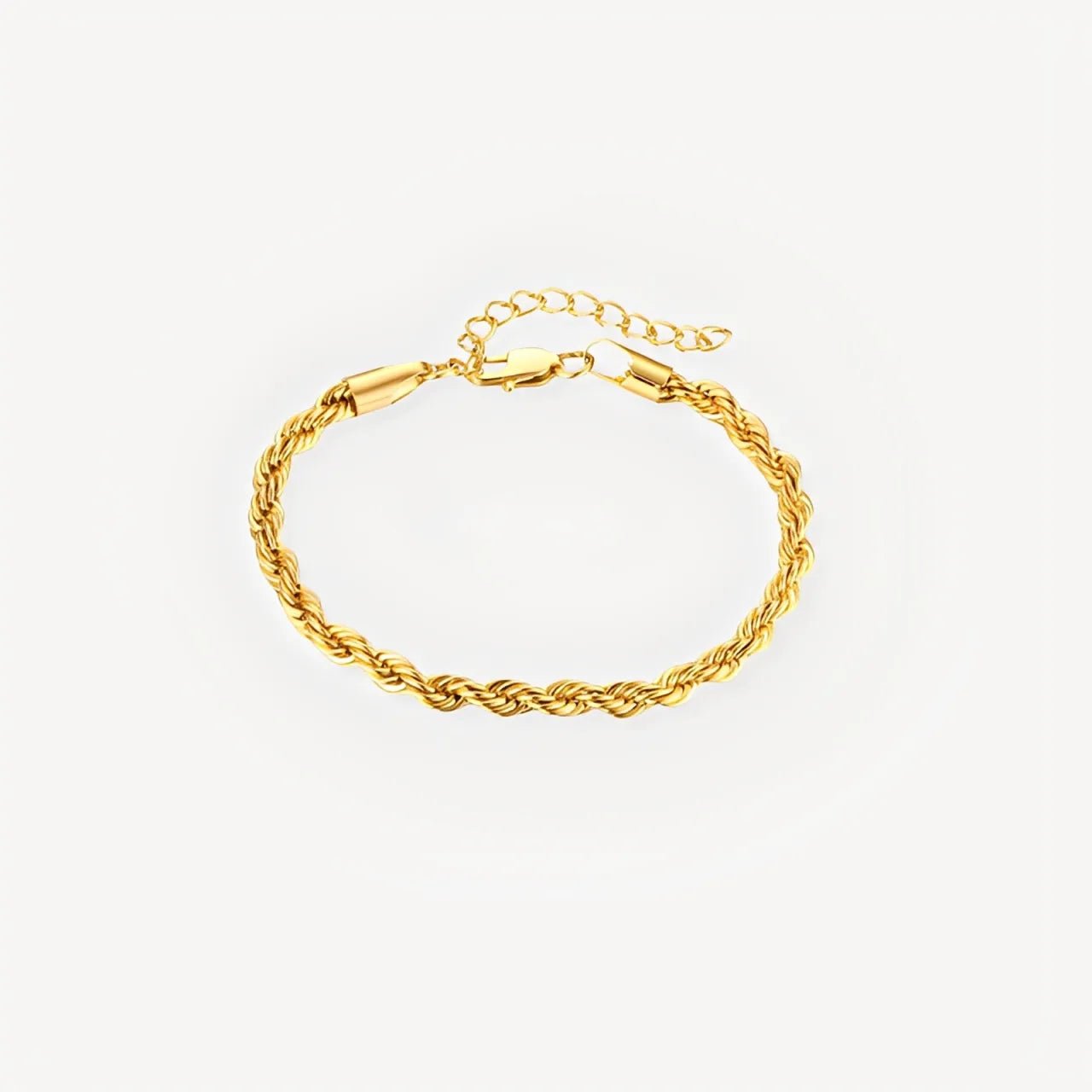 Gold rope chain bracelet on a light gray background