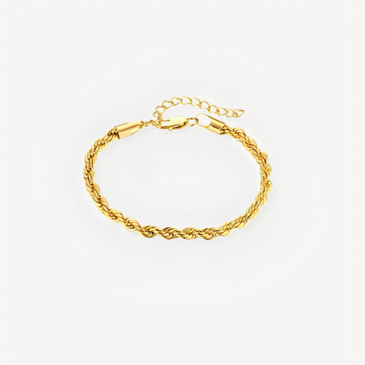 Gold rope chain bracelet on a light gray background
