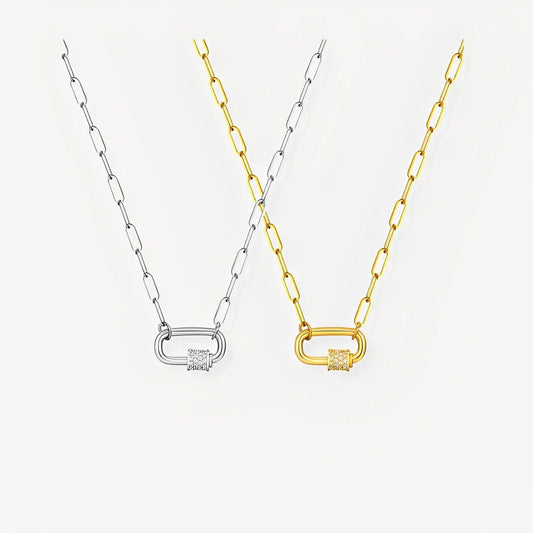 Two necklaces with lock pendants, one gold and one silver, on a light gray background.