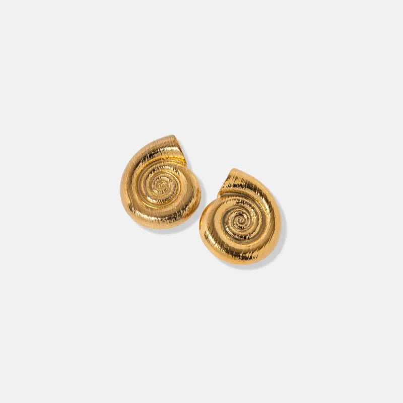 Pair of gold spiral earrings on a white background